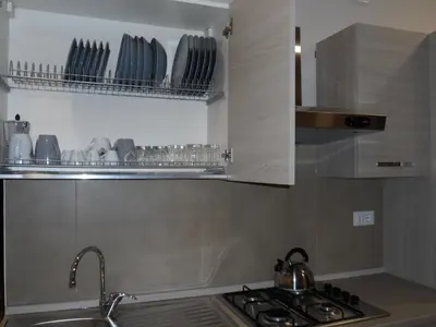 Cucina o angolo cottura di Residence Palazzo dei Delfini by RECEPTIO