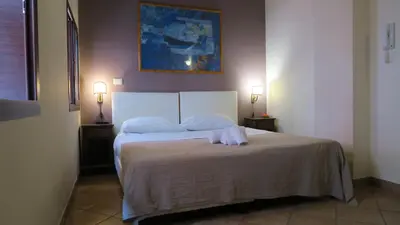 Letto o letti in una camera di Cortile dei Sogni