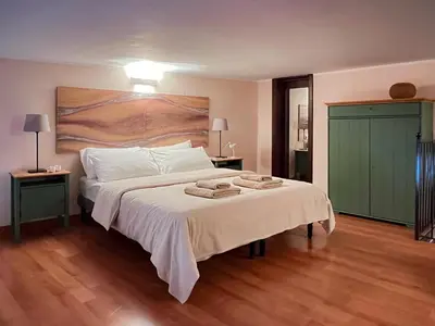 Letto o letti in una camera di Etna Home
