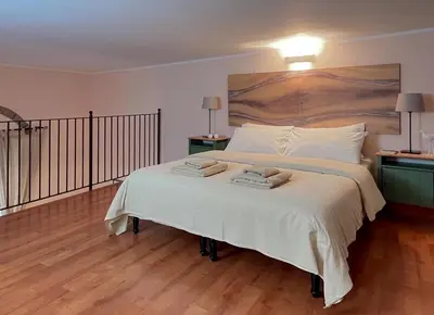 Letto o letti in una camera di Etna Home