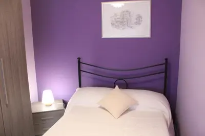 Letto o letti in una camera di B&B President Palace