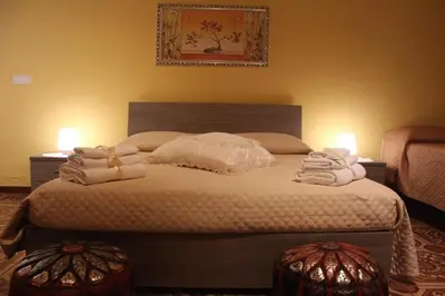Letto o letti in una camera di B&B President Palace