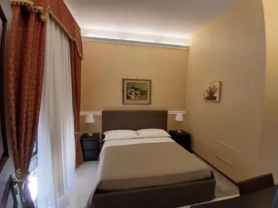 Letto o letti in una camera di La Suite del Vulcano