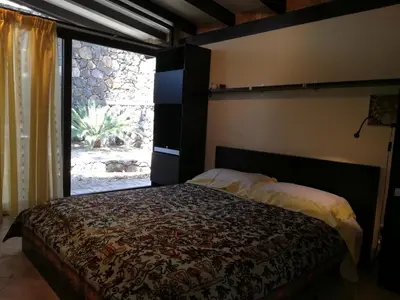 Letto o letti in una camera di Lily house