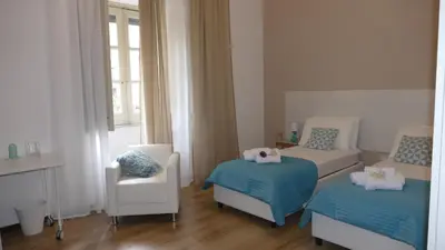 Letto o letti in una camera di B&B Fusorario