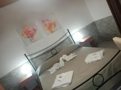 Letto o letti in una camera di Casa Maya Ognina Sea casa indipendente Catania
