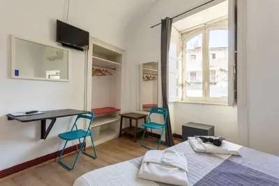 Letto o letti in una camera di Da Gianni e Lucia Rooms with bathroom in the city center