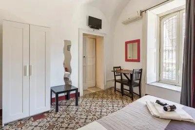 Letto o letti in una camera di Da Gianni e Lucia Rooms with bathroom in the city center