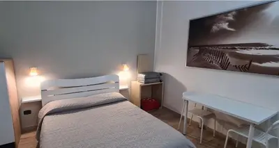 Letto o letti in una camera di Catania Home Cibali