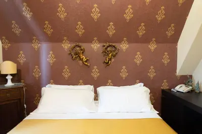 Letto o letti in una camera di Hotel Villa Dorata