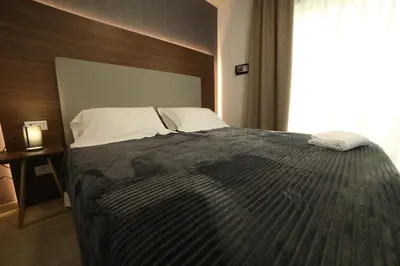 Letto o letti in una camera di 8room Hotel
