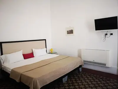 Letto o letti in una camera di Hotel Valentino