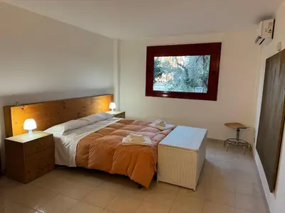 Letto o letti in una camera di Villa Rama