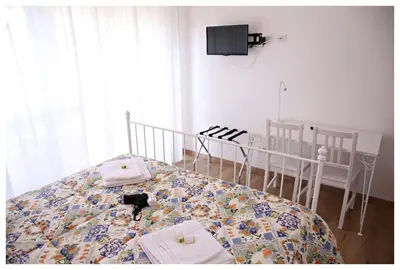 Letto o letti in una camera di Tosca B&B