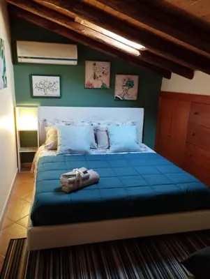 Letto o letti in una camera di Petite Maison dell'Etna