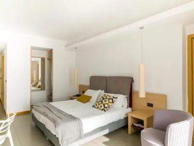 Letto o letti in una camera di Esperia Palace Hotel & Resort Spa