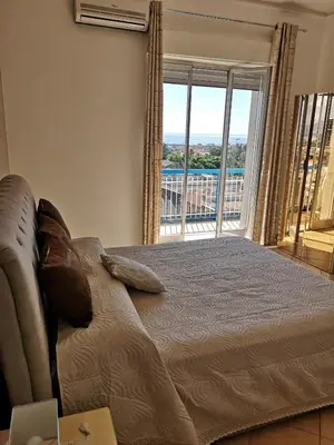 Letto o letti in una camera di Casa Donna Rosaria tra Etna e Taormina