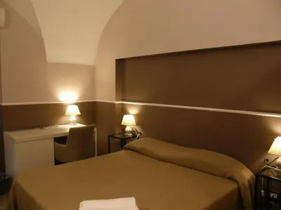 Letto o letti in una camera di Il Gattopardo House