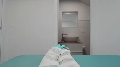 Letto o letti in una camera di Tivoli ShortLets - Catania