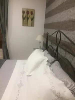Letto o letti in una camera di Etna Holidays Home SereLeo