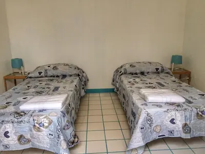 Letto o letti in una camera di Le Chiazzette