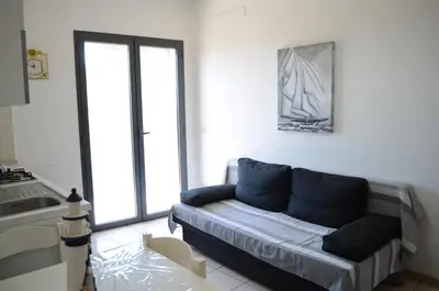 Area soggiorno di Suite Riviera - comfort moderno vicino al mare