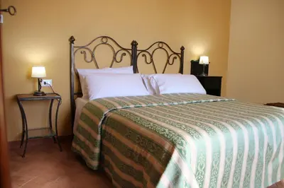 Letto o letti in una camera di Feudo Magazzeni Etna