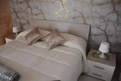 Letto o letti in una camera di Il Cuore dell'Etna