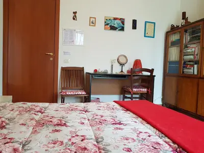 Letto o letti in una camera di Villa Muse Holiday oasi sul mare di CapoMulini, Acireale - Sicilia, Italy Locazione Turistica