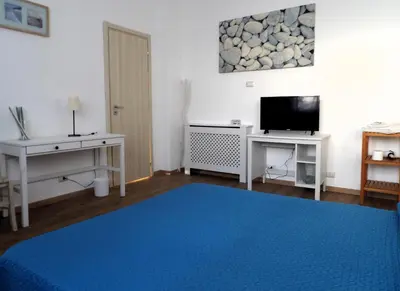 Letto o letti in una camera di B&B Stella Marina