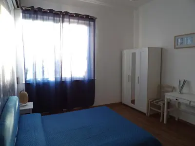 Letto o letti in una camera di B&B Stella Marina