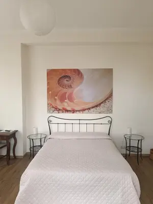 Letto o letti in una camera di B&B Stella Marina