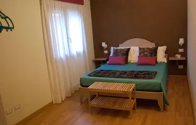 Letto o letti in una camera di B&B Le Antiche Cisterne