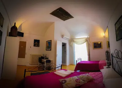 Letto o letti in una camera di The Artist's Home Catania Centro