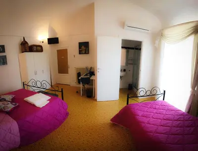 Letto o letti in una camera di The Artist's Home Catania Centro