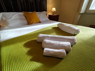 Letto o letti in una camera di Don Michelino Etna House