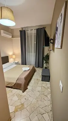 Letto o letti in una camera di Etnea Glamour House