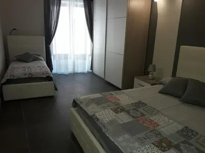 Letto o letti in una camera di Casa Sicilia Acireale