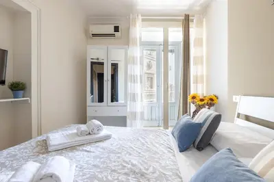 Letto o letti in una camera di La casa di carta in piazza stesicoro