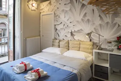 Letto o letti in una camera di RossoCorallo B&B