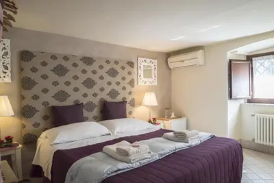 Letto o letti in una camera di RossoCorallo B&B