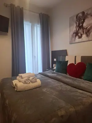 Letto o letti in una camera di Dolce Vita