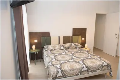 Letto o letti in una camera di Dolce Vita