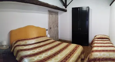 Letto o letti in una camera di Villa Alessio - Case Vacanza con Piscina sull'Etna
