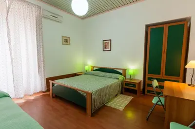Letto o letti in una camera di Al Villino Sunset appartamento in villa con piscina