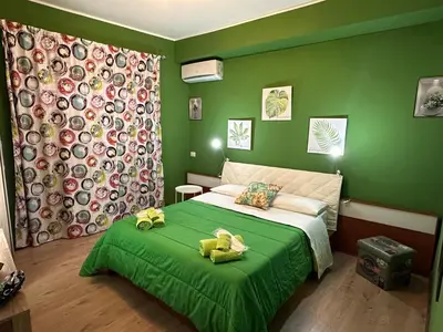 Letto o letti in una camera di Talya Catania