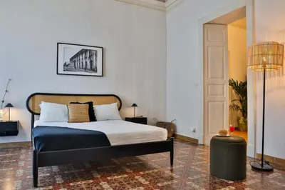 Letto o letti in una camera di La Casa del Gelsomino Palace