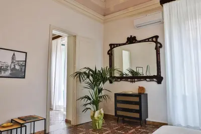 Letto o letti in una camera di La Casa del Gelsomino Palace