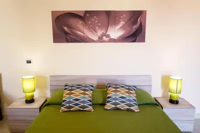 Letto o letti in una camera di Rocca degli Etnei