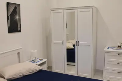 Letto o letti in una camera di Le case di Carlotta & Giorgia